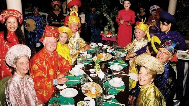 Foreign visitors to Hue ancient city dressed in royal costumes and enjoying royal dishes