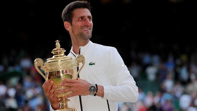 Serbia's Novak Djokovic with the trophy as he celebrates winning the final against Switzerland's Roger Federer - Wimbledon - All England Lawn Tennis and Croquet Club, London, Britain - July 14, 2019. (Photo: Reuters)