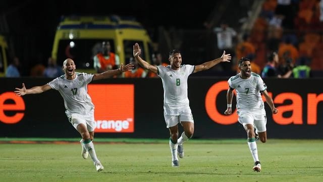 Algeria's Riyad Mahrez celebrates scoring their second goal with Adlene Guedioura and Youcef Belaili - Africa Cup of Nations 2019 - Semi Final - Algeria v Nigeria - Cairo International Stadium, Cairo, Egypt - July 14, 2019. (Photo: Reuters)