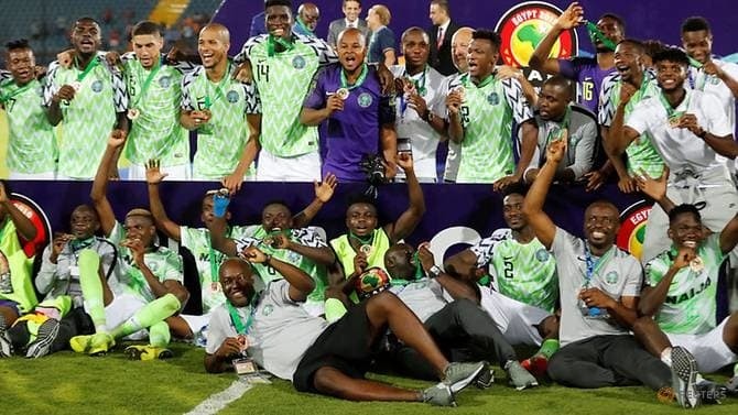Nigeria players celebrate after winning the third place playoff. (Reuters)