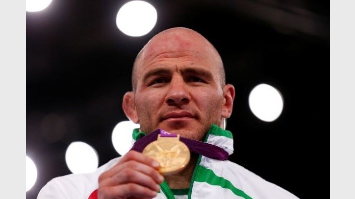 FILE PHOTO: Uzbekistan's Artur Taymazov poses with his gold medal at the podium of the Men's 120Kg Freestyle wrestling at the ExCel venue during the London 2012 Olympic Games August 11, 2012. (Reuters)