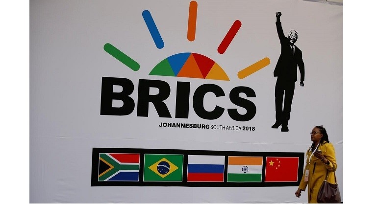 A delegate walks past a BRICS logo ahead of the 10th BRICS Summit, in Sandton, South Africa, July 24, 2018. (Photo: Reuters)