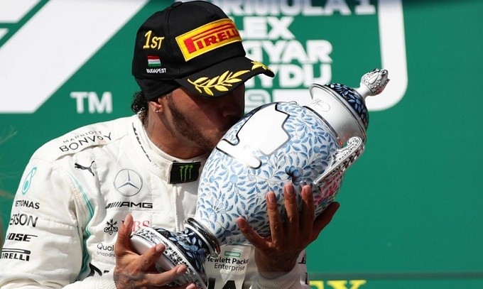 Formula One F1 - Hungarian Grand Prix - Hungaroring, Budapest, Hungary - August 4, 2019 Mercedes' Lewis Hamilton celebrates winning the Hungarian Grand Prix by kissing the trophy. (Reuters)