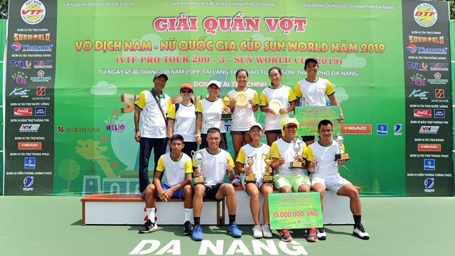 Hung Thinh - HCM City players celebrate with their trophies at the tournament.
