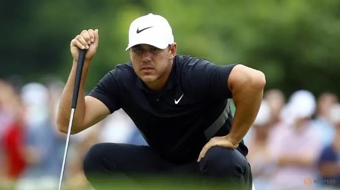 Aug 25, 2019; Atlanta, GA, USA; Brooks Koepka lines up his putt on the fifth green during the final round of the Tour Championship golf tournament at East Lake Golf Club. (Reuters)