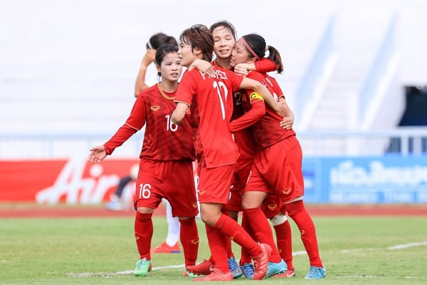 Vietnamese players celebrate scoring a goal during their semifinal match against the Philippines on August 25.
