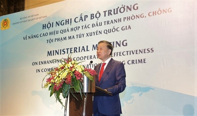 Vietnamese Minister of Public Security To Lam speaks at the meeting. 