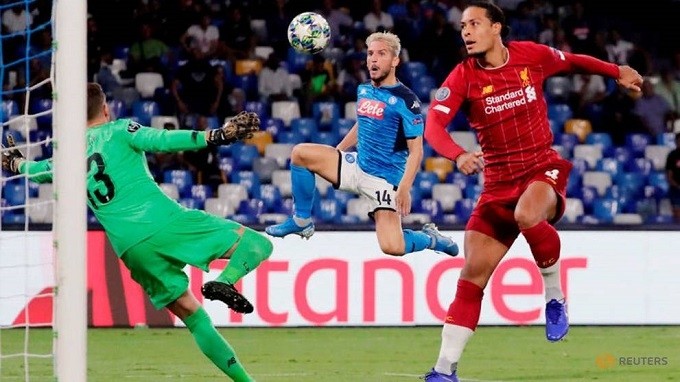 Soccer Football - Champions League - Group E - Napoli v Liverpool - Stadio San Paolo, Naples, Italy - September 17, 2019 Napoli's Dries Mertens in action with Liverpool's Virgil van Dijk and Adrian. (Reuters)