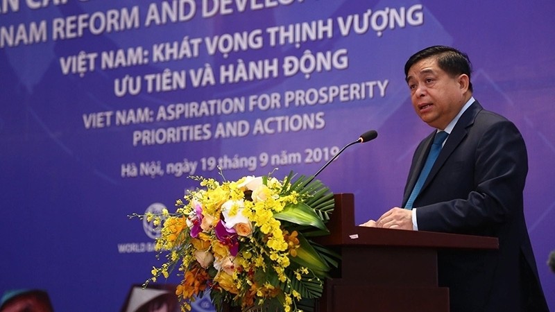 Minister of Planning and Investment Nguyen Chi Dung speaking at the forum (Photo: Le Tien)
