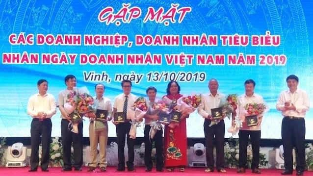 Local enterprises in Nghe An province honoured at the meeting. (Photo: NDO)