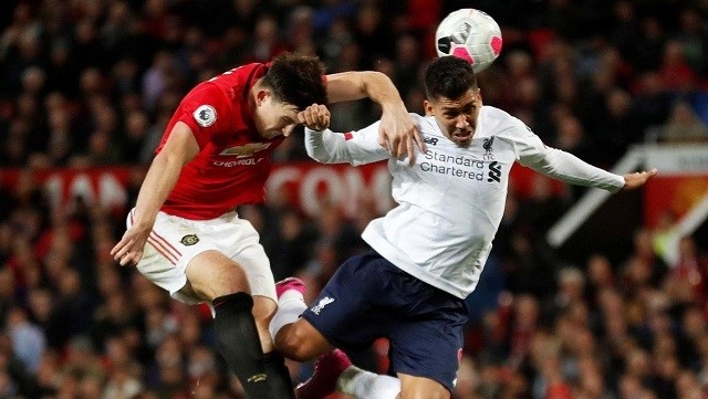 Soccer Football - Premier League - Manchester United v Liverpool - Old Trafford, Manchester, Britain - October 20, 2019 Manchester United's Harry Maguire in action with Liverpool's Roberto Firmino. (Photo: Reuters)