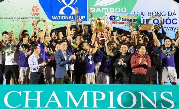 Hanoi FC players celebrate their first-ever National Cup trophy.
