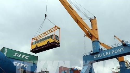 This is the first commercial bus shipment of Thaco after more than 16 years of investment and development in the Vietnamese automotive industry. (Photo: VNA)