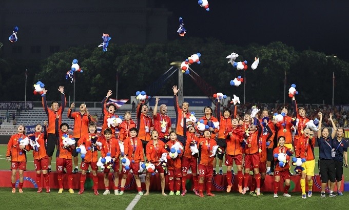 The Vietnam women's team celebrate winning their sixth SEA Games gold medal in the Philippines on December 8, 2019.