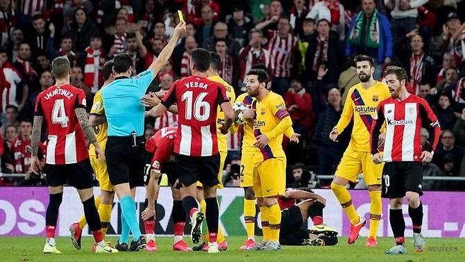 Soccer Football - Copa del Rey - Athletic Bilbao v FC Barcelona - San Mames, Bilbao, Spain - February 6, 2019 FC Barcelona's Lionel Messi is shown a yellow card by referee Juan Martinez. (Reuters)