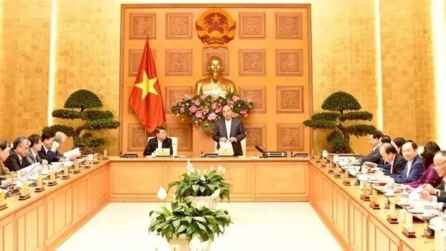 PM Nguyen Xuan Phuc chairs a meeting of the national advisory council for financial and monetary policies.