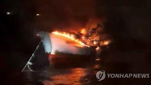 The fishing boat caught fire in the early morning of March 4. (Photo: Yonhap)