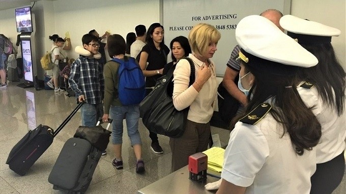 Passengers are put under health quarantine at Tan Son Nhat Airport in Ho Chi Minh City.
