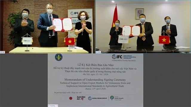 At the signing ceremony in Hanoi on April 15.