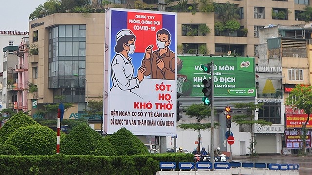 Large posters are installed at key intersections in Hanoi to attract the attention of road users. (Photo: NDO/Thuy Nguyen)