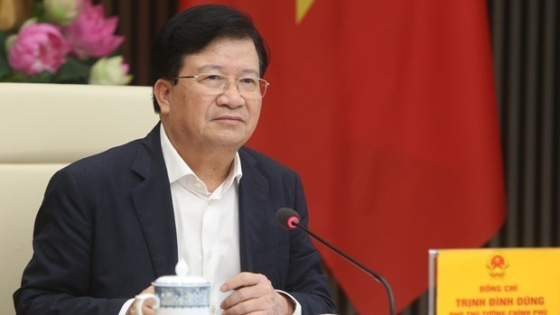 Deputy Prime Minister Trinh Dinh Dung speaking at the meeting (Photo: VNA)