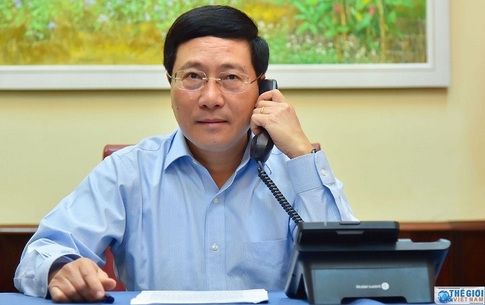Deputy Prime Minister and Foreign Minister Pham Binh Minh (pictured) holds phone talks with Estonian Foreign Minister Urmas Reinsalu on April 29. (Photo: Baoquocte.vn)