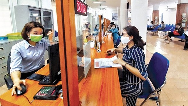 Job seekers are looking for employment opportunities at a job centre in Hanoi.