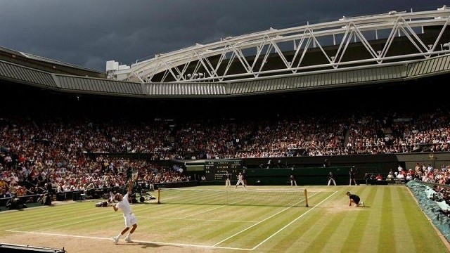 Dark clouds drift over centre court during the finals match between Roger Federer of Switzerland and Rafael Nadal of Spain at the Wimbledon tennis championships in London July 6, 2008. (Photo: Reuters)