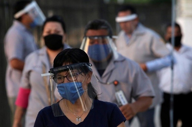 Workers from US auto parts maker Aptiv Plc arrive at the plant during the coronavirus disease (COVID-19) outbreak in Ciudad Juarez, Mexico May 18, 2020. (Photo: Reuters)
