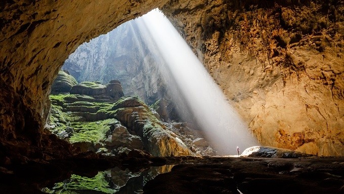 A shaft of sunlight hits a section of Son Doong Cave, called Watch Out for Dinosaurs, daily around noon. (Photo: Ryan Deboodt)