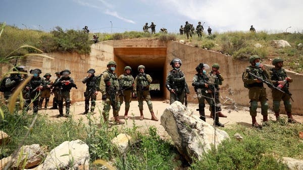 Israeli troops stand guard as Palestinians are marking the 72nd anniversary of Nakba Day and protest against Israeli plan to annex parts of the occupied West Bank, in the village of Sawiya near Nablus city, May 15, 2020. (Reuters)