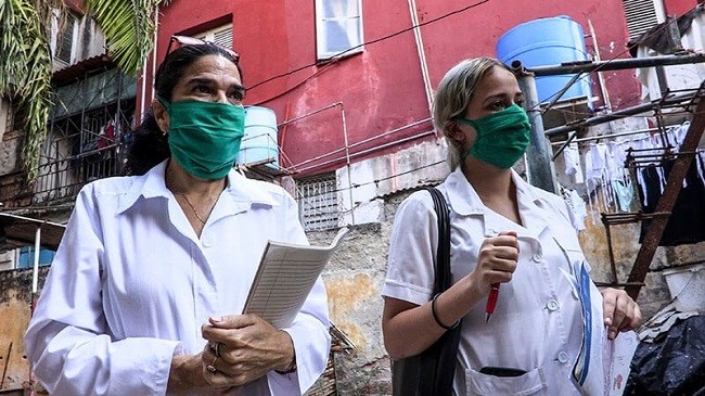 Cuban doctors go door-to-door in search of possible cases of the novel coronavirus. (Photo: AFP)