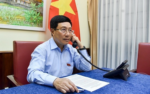 Deputy Prime Minister and Foreign Minister Pham Binh Minh during a phone conversation with Swiss Foreign Minister Ignazio Cassis on June 11. (Photo: VGP)