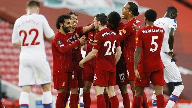 Premier League - Liverpool v Crystal Palace - Anfield, Liverpool, Britain - June 24, 2020 Liverpool's Fabinho celebrates scoring their third goal with teammates, as play resumes behind closed doors following the outbreak of the coronavirus disease. (Photo: Reuters)