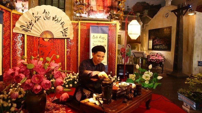 An artisan practicing the art of enjoying royal tea 