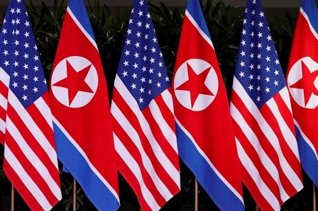 US and DPRK national flags during the meeting of US President Donald Trump and DPRK Chairman Kim Jong Un at the Capella Hotel on Sentosa island in Singapore, on June 12, 2018. (Photo: Reuters)