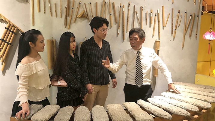 Musicologist Ba Pho introduces young people to traditional musical instruments at Ba Pho’s Music House 