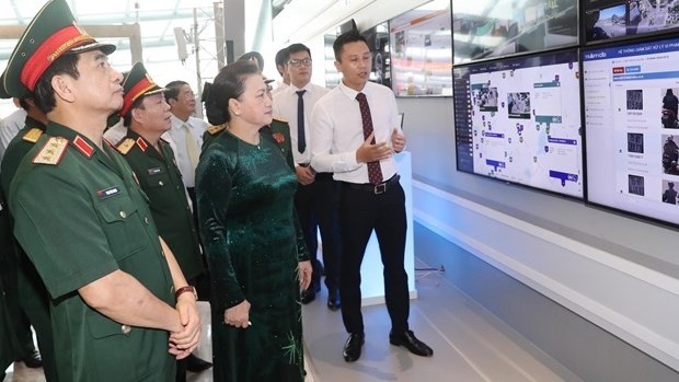 National Assembly Chairwoman Nguyen Thi Kim Ngan (front, second, left) visits Viettel's headquarters in Hanoi on July 16 (Photo: VNA)