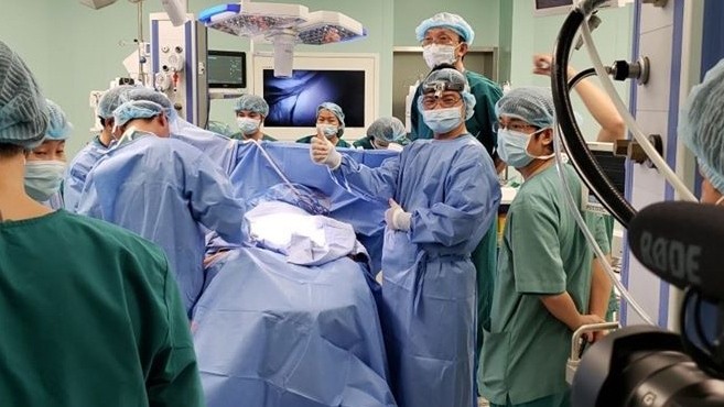 The happiness of the surgical team when they successfully separated the conjoined twins.