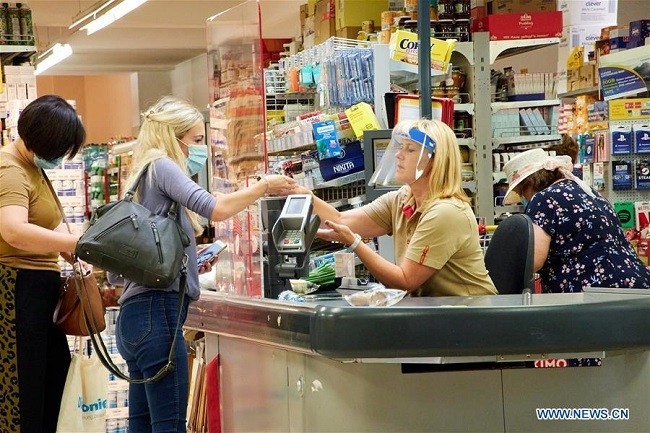 People wearing face masks are seen in a supermarket in Vienna, Austria, on July 24, 2020. Masks were mandatory again from Friday in banks, supermarkets and post offices in Austria. (Photo: Xinhua)