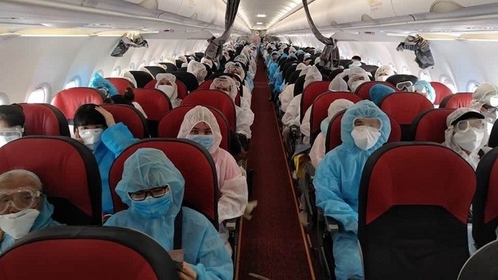 Vietnamese citizens on the repatriation flight home from Myanmar on July 30, 2020. (Photo: MOFA)