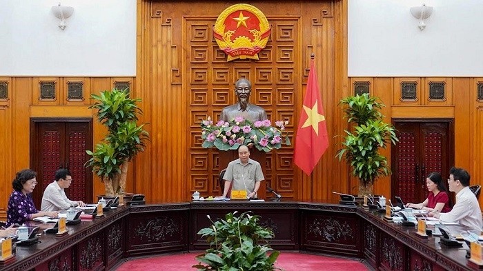 PM Nguyen Xuan Phuc has called for resolve to perform the dual tasks of containing COVID-19 and preventing negative economic growth. (Photo: NDO/Tran Hai)