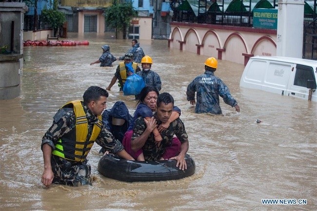  Nepalese army personnel rescue local people after a heavy rainfall in Kathmandu, Nepal, July 12, 2019. Nepal was hit by heavy rainfall that caused floods and landslides in many places. (Photo: Xinhua)