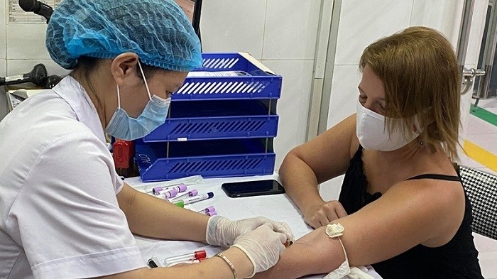 Kelly Michelle Koch undergoing a check-up for plasma donation in Hanoi on August 12, 2020.