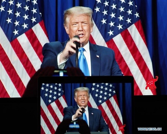 Photo taken in Arlington, Virginia, the United States, on Aug. 24, 2020 shows screens displaying US President Donald Trump speaking during the 2020 Republican National Convention in Charlotte, North Carolina. (Source: Xinhua)