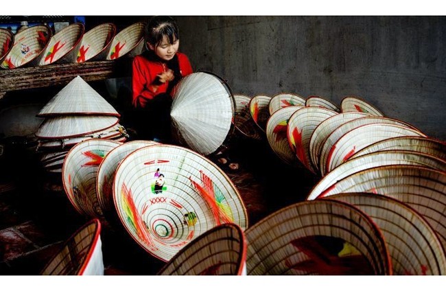 80% of local households in Ren village still practice the craft of conical hat making 
