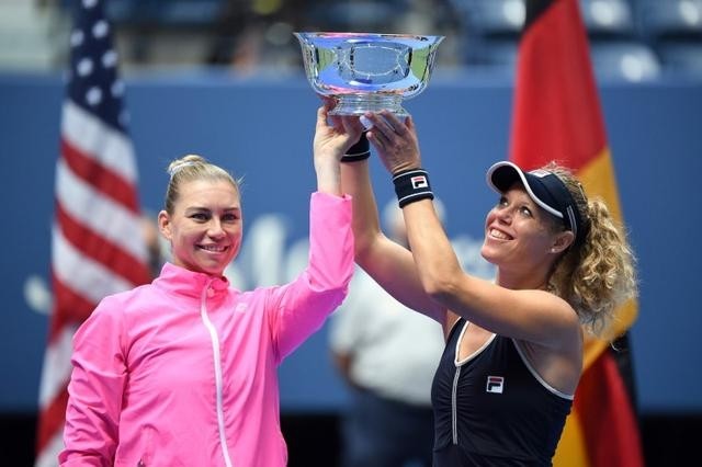Vera Zvonareva of Russia and Laura Siegemund of Germany celebrate winning the US Open women's doubles title. (Reuters)