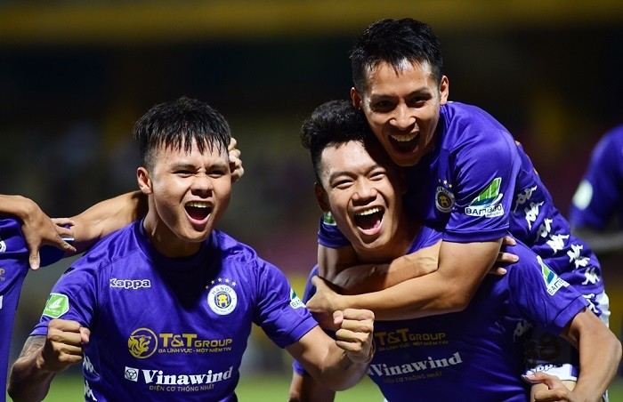 Hanoi FC players celebrate a goal during their match with Ho Chi Minh City. (Photo: NDO/Tran Hai)