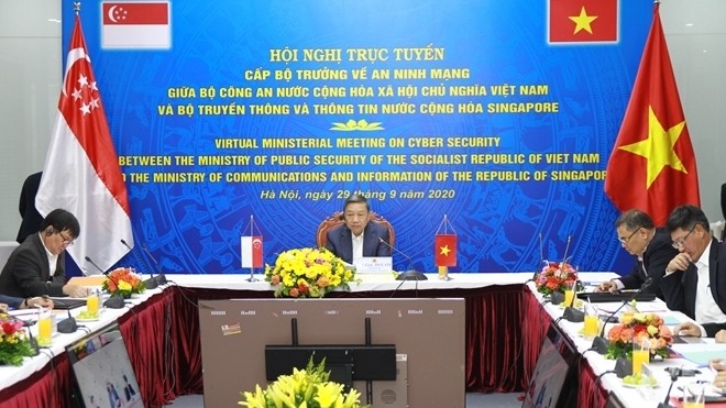 Public Security Minister To Lam (C) speaks at the conference. (Photo: cand.com.vn)