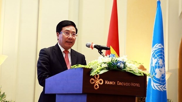 Vietnamese Deputy Prime Minister and Foreign Minister Pham Binh Minh delivers his remarks at a reception to celebrate the UN’s 75th founding anniversary in Hanoi on October 23. (Photo: VNA)